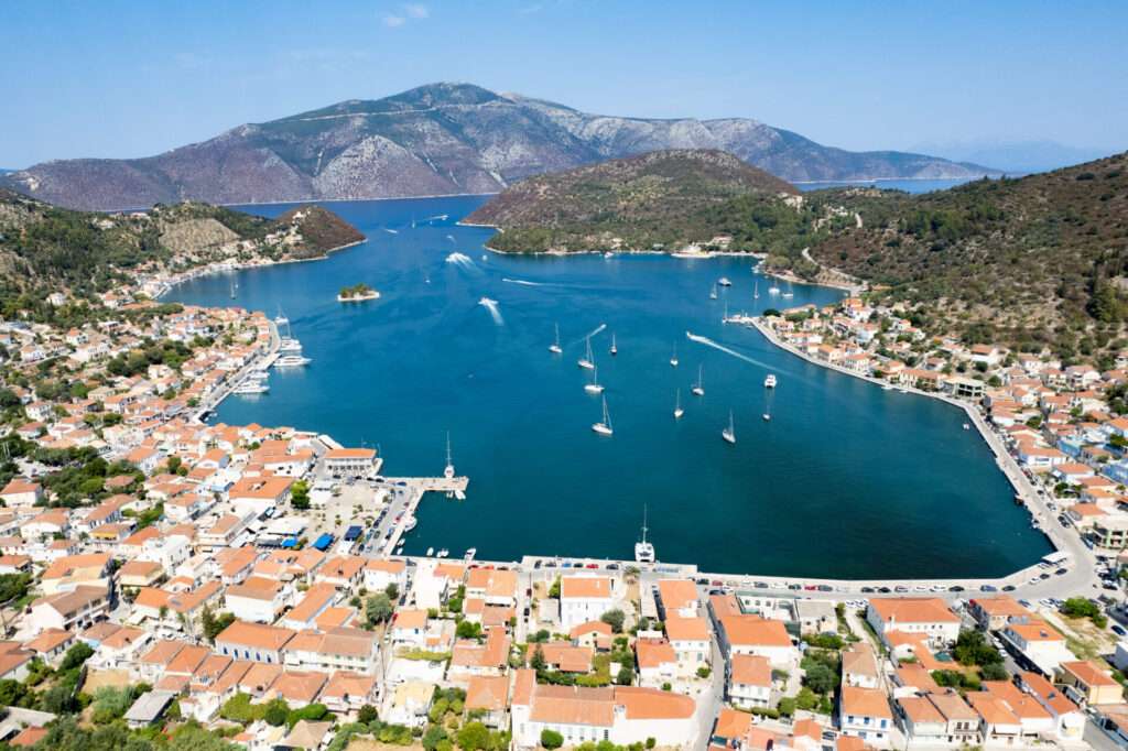 Aerial View Of Vathy, The Main Port Of Ithaki Island In Greece, Showing Boats Mooring In The Bay